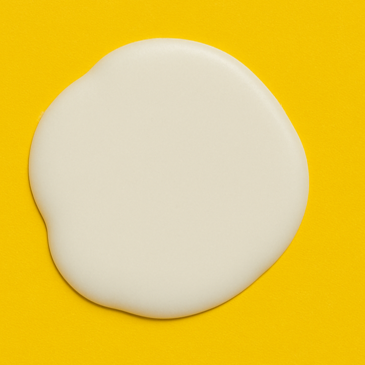 White round wax on a yellow background