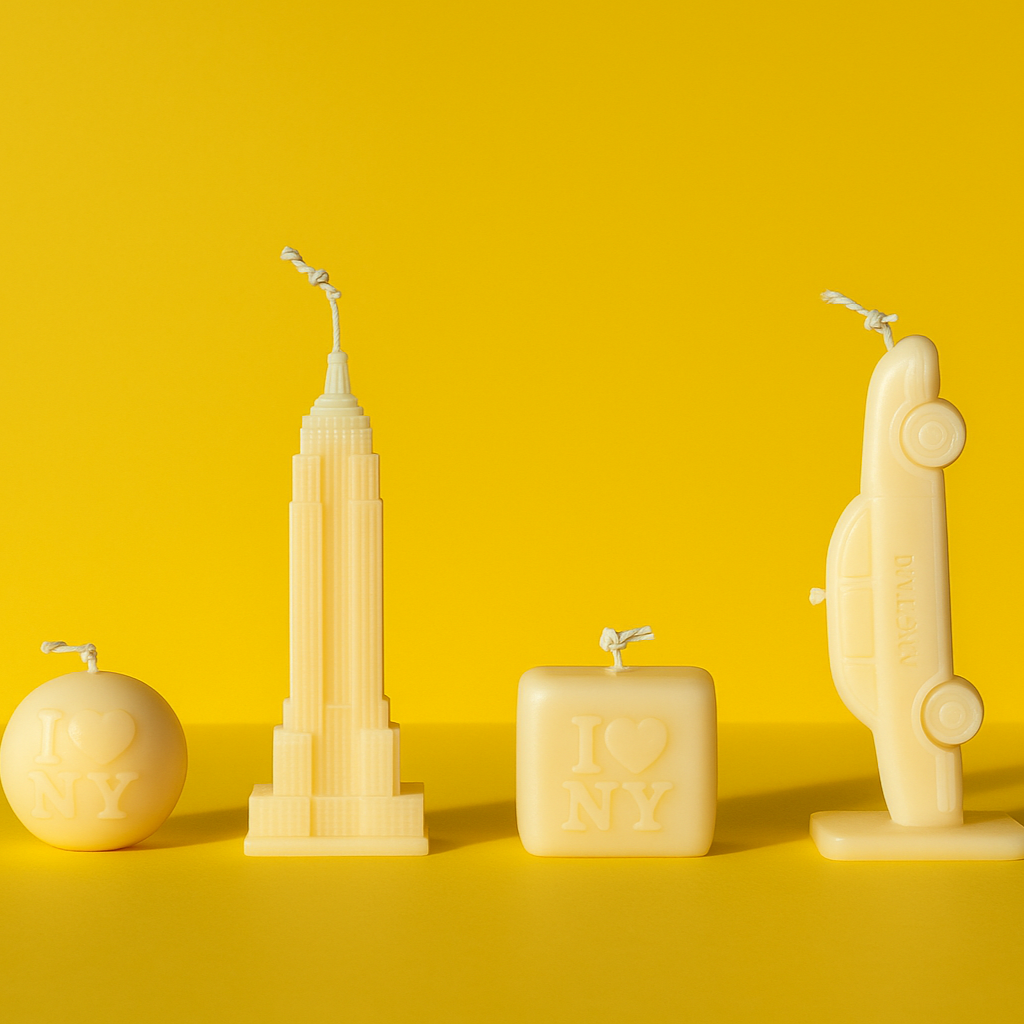 Set of five unique candle sculptures on a yellow background